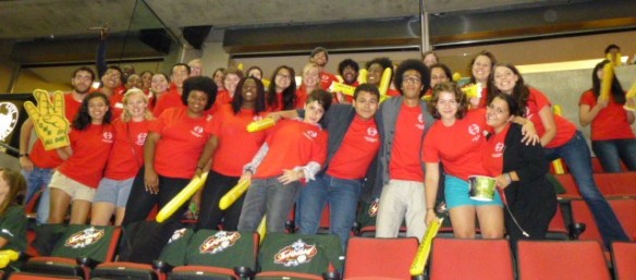 City Year corps members cheer for the Seattle Storm
